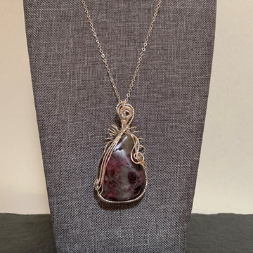 Pendant made of Red Tourmaline /Rubelite Stone with silver wrap; 1 3/8" w x 2.75" h, incl bail