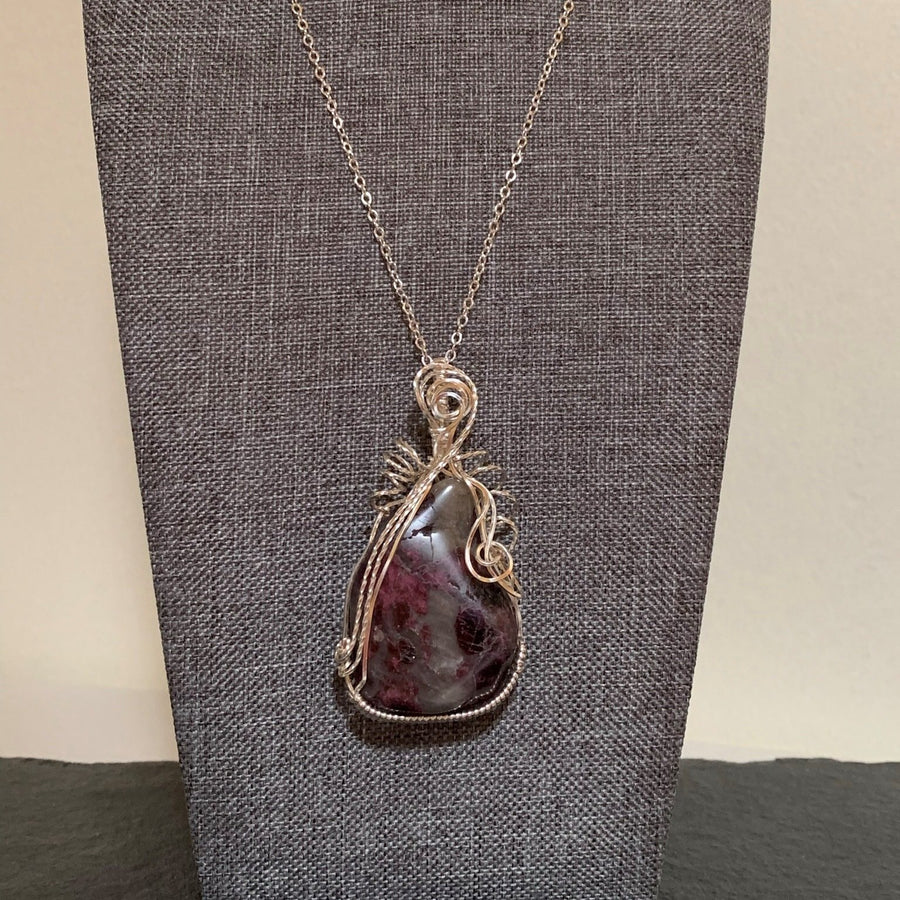 Pendant made of Red Tourmaline /Rubelite Stone with silver wrap; 1 3/8" w x 2.75" h, incl bail