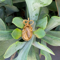 Pendant made of Yellow Tiger Eye oval with gold wrap; 1" w x 2" h incl bail