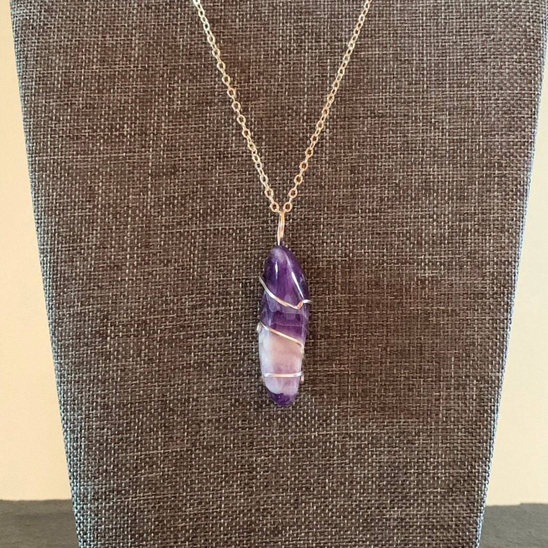 Pendant made of Chevron Amethyst long nugget with silver wrap; 1/2" w x 1 7/8" h, incl bail