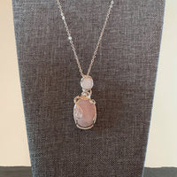 Pendant made of Double stone Rose Quartz with silver wrap; 3/4" w x 2.75" h, incl bail