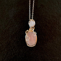 Pendant made of Double stone Rose Quartz with silver wrap; 3/4" w x 2.75" h, incl bail