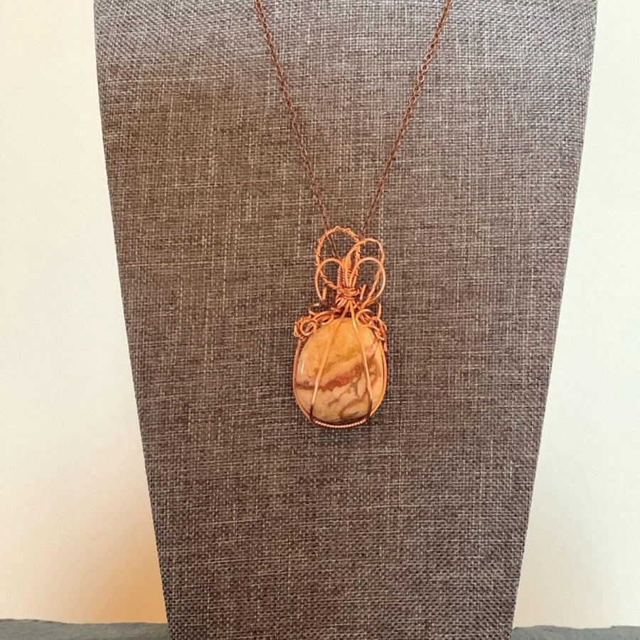 Pendant made of Yellow Jasper with copper wrap; 1" w x 2 1/8" h, incl bail