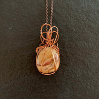 Pendant made of Yellow Jasper with copper wrap; 1" w x 2 1/8" h, incl bail