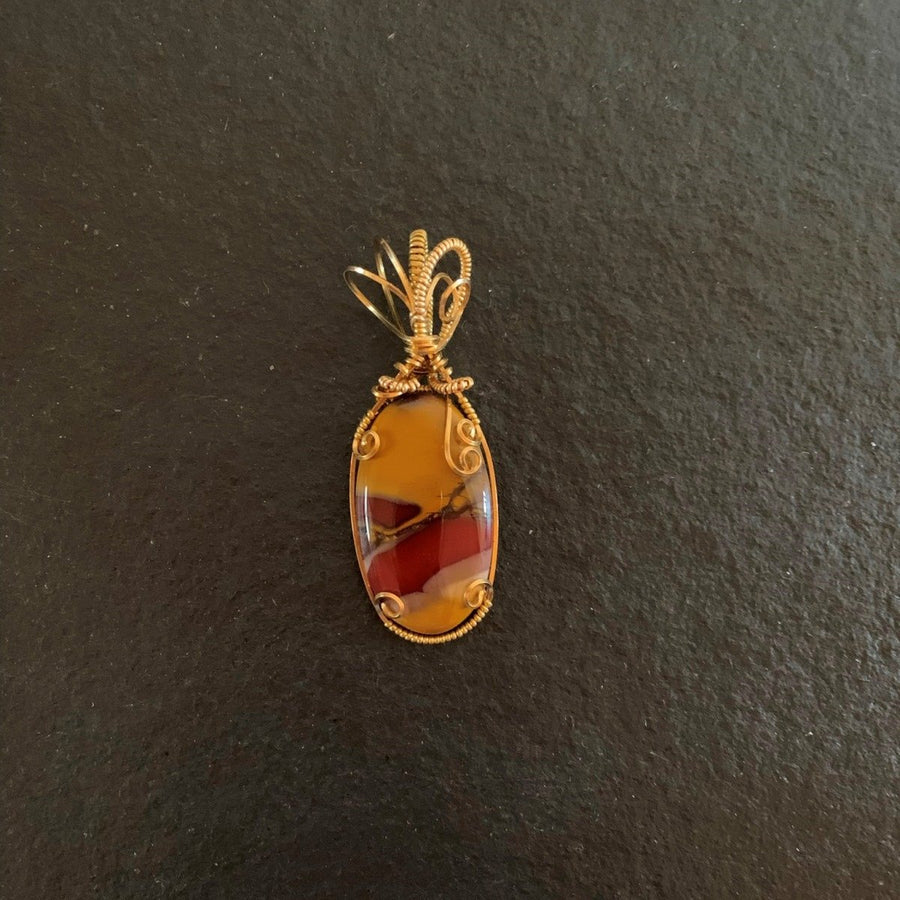 Pendant made of Mookaite oval stone w/gold wrap; 7/8" x 2.50" incl bail- Maroon & Gold