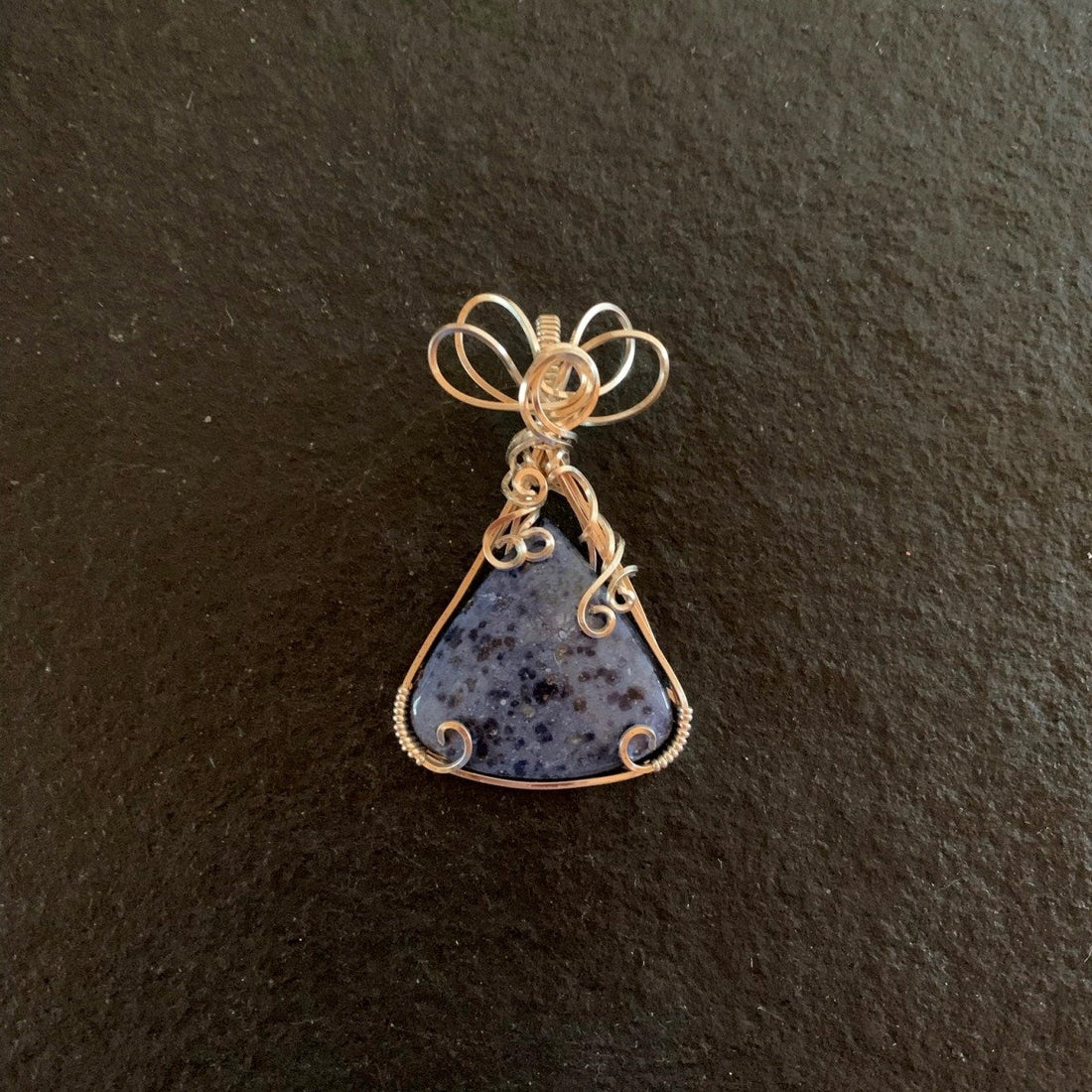 Pendant made of Dumortierite Triangle with silver wrap; 1.25" w x 2" h, incl bail