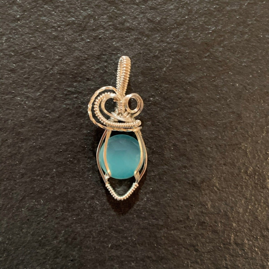 Pendant made of Rose Cut Aqua Chalcedony stone with silver wrap; 5/8" w x 1.75" h, incl bail