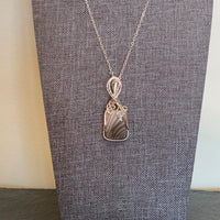 Pendant made of Flint Stone with silver wrap; .75" W X 1 7/8" H, INCL BAIL