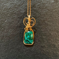 Pendant made of Chrysocolla Malachite stone with gold wrap; 8/5" w x 2" h, incl bail
