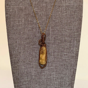 Pendant made of Yellow Sapphire stone with Vintage Bronze wrap; .5" w x 2.25" h, incl bail