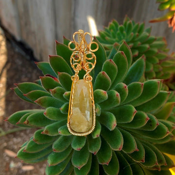 Pendant made of Yellow Sapphire stone with Gold Wrap; 5/8" w x 2.25" h, incl bail