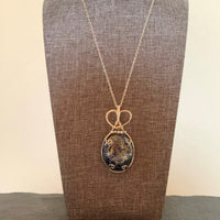 Pendant made of Large Lapis Lazuli in Pyrite Oval with silver wire wrap and crystal accent beads; 1 1/8" w x 2.5" h, incl bail