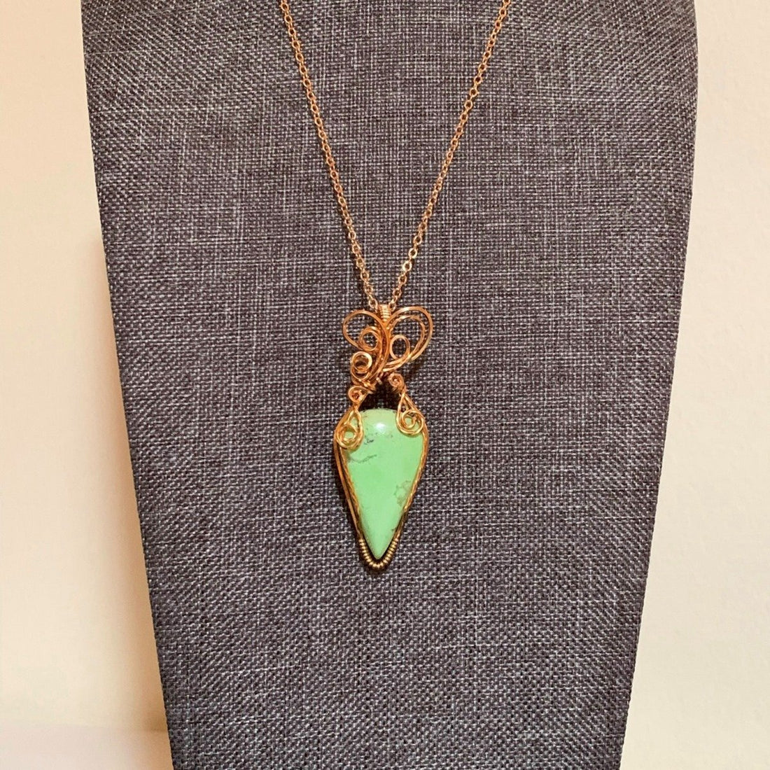 Pendant made of Lemon Chrysoprase Teardrop stone with gold wire wrap; .75" w x 2.25" l, incl bail