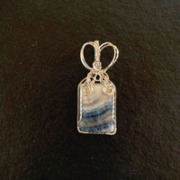 Pendant made of Stichtite Square blue & white stone with silver wire wrap; 1" w x 2.25" l, incl bail