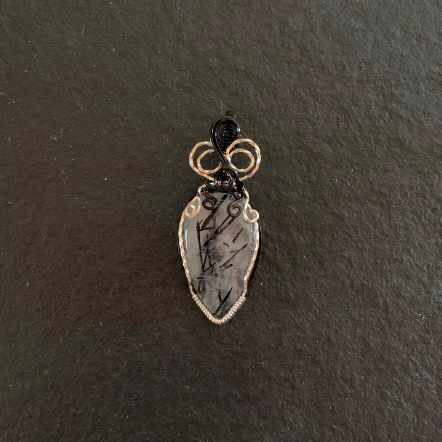 Pendant made of Black Rutilated Quartz Teardrop with black & silver wrap; 7/8" w x 2.25" long, incl bail