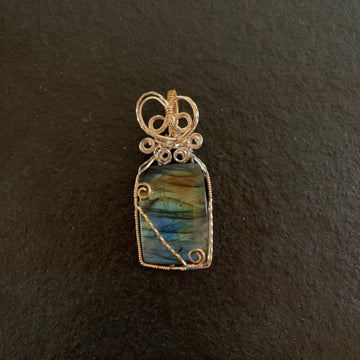 Pendant made of Fire Labradorite Rectangle Stone with Gold & Silver wire wrap; 1" w x 2.5" long, incl bail