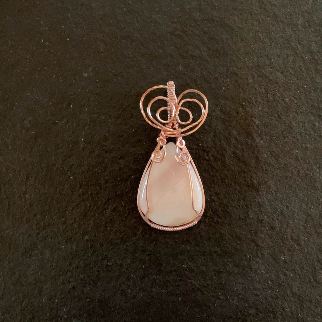 Pendant made of Pink Opal Teardrop stone with Rose Gold wire wrap; 1" w X 2 1/8" long incl bail