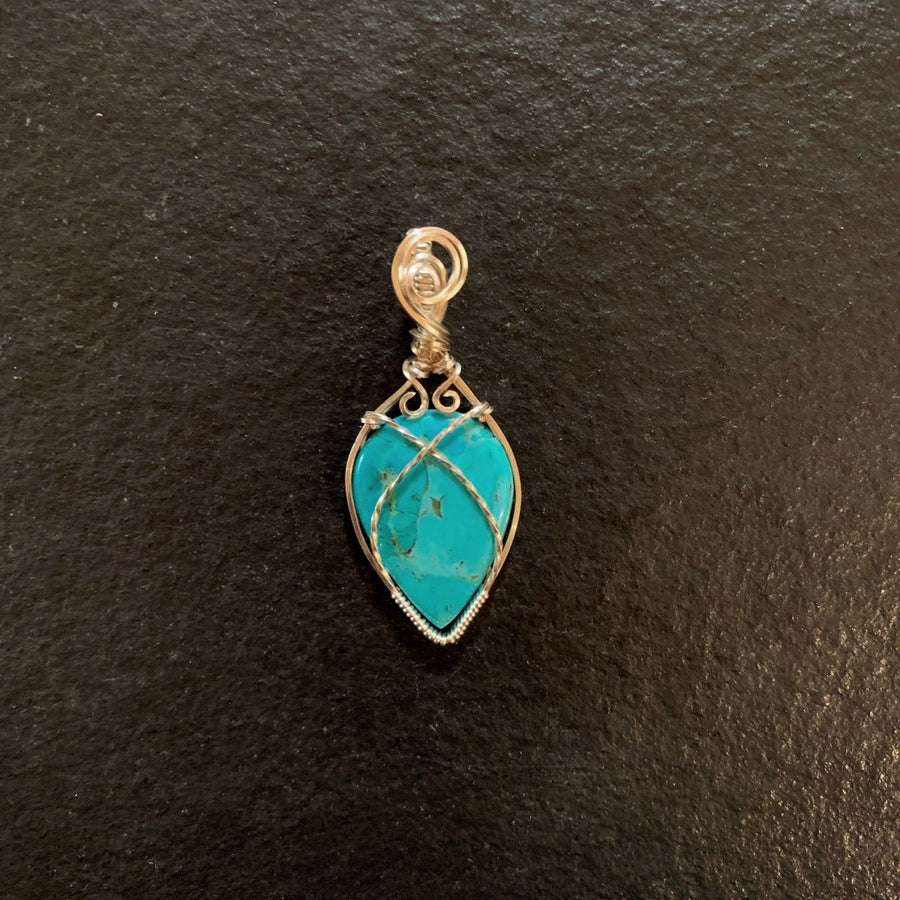 Pendant made of Turquoise Teardrop Stone with Silver wire wrap; 1" w x 2.25" long incl bail