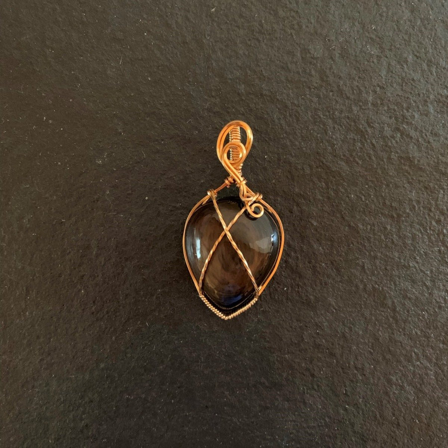 Pendant made of Golden Sheen Obsidian Teardrop stone with gold wire wrap; 1.25" w x 2 1/8" long incl bail