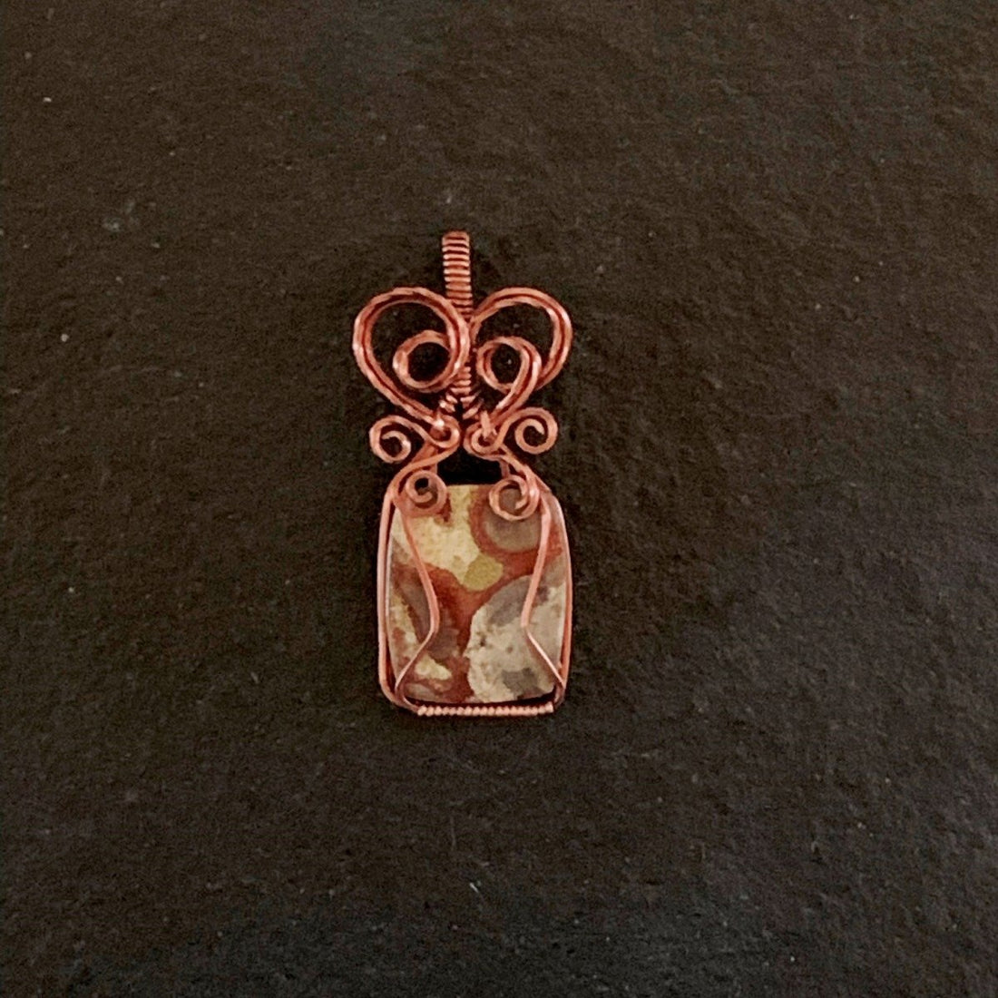 Pendant made of Natural Mushroom Ryolite Jasper Rectangle with Antique Copper wire wrap; 7/8" w x 2" long, incl bail