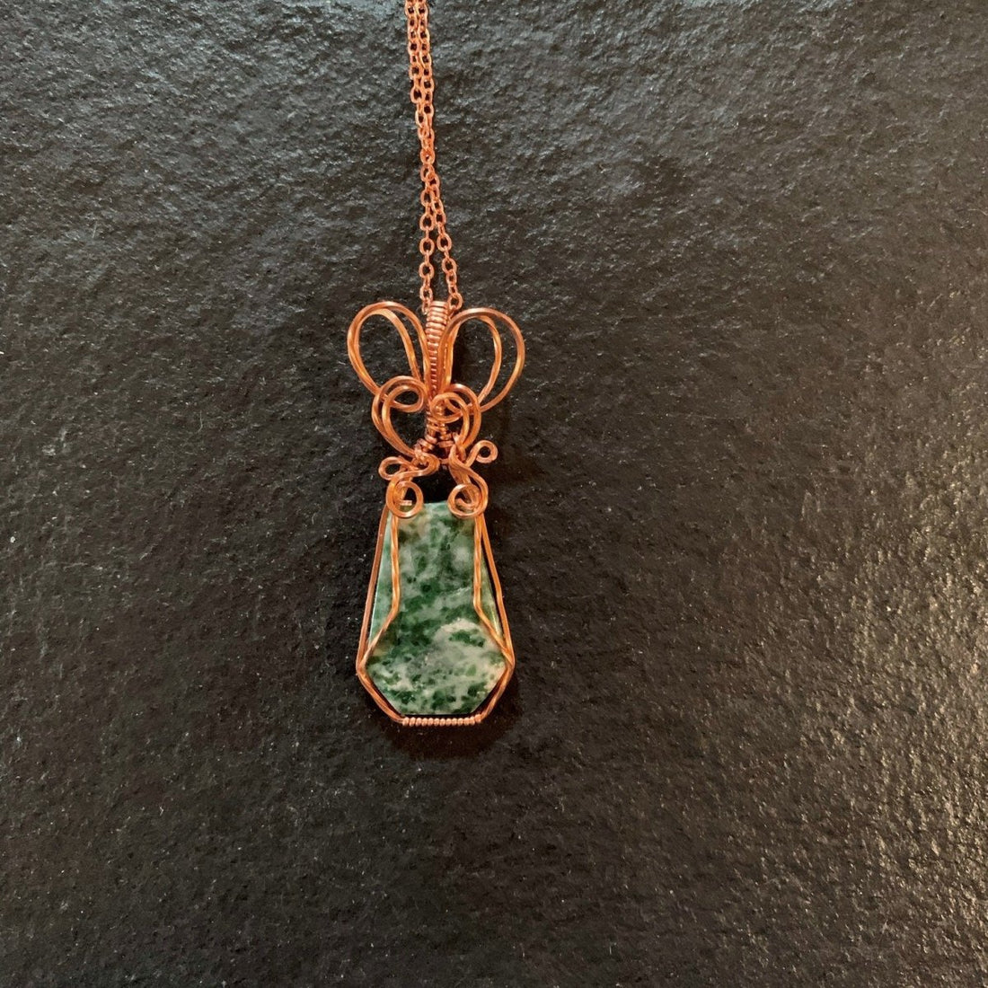 Pendant made of Green Diopside Quartz Hexagon with copper wire wrap; 7/8" w x 2 1/8" long, incl bail