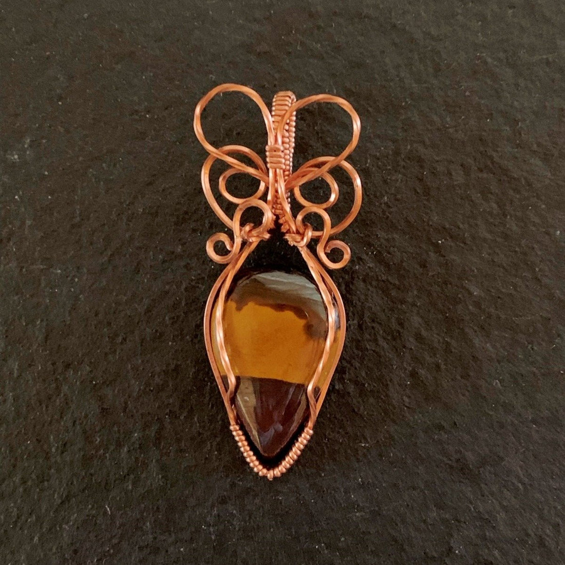 Pendant made of Natural Desert Jasper Teardrop stone with copper wire wrap; 7/8" w x 2" long, incl bail