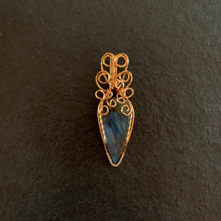 Pendant made of Blue Fire Labradorite Teardrop stone with gold wire wrap; .75" w x 2 3/8" long, incl bail