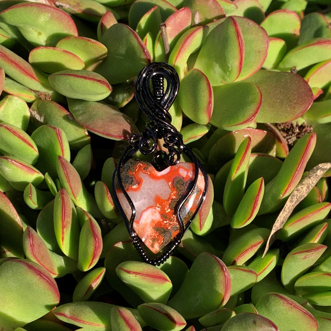 Moroccan Seam Agate Heart with Black Wire Wrap; 7/8" w x 1.75" long incl bail